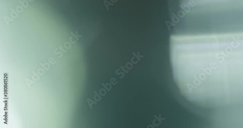 Slow motion real lens flare through glass effects for overlay or transition