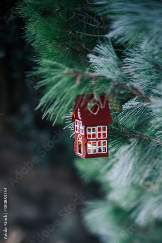 christmas toy on a snow-covered tree photo