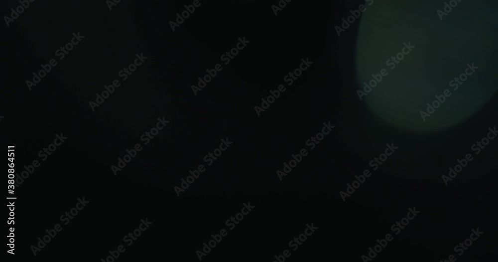 Slow motion real lens flare through glass effects for overlay or transition Slow motion real lens flare through glass effects for overlay or transition