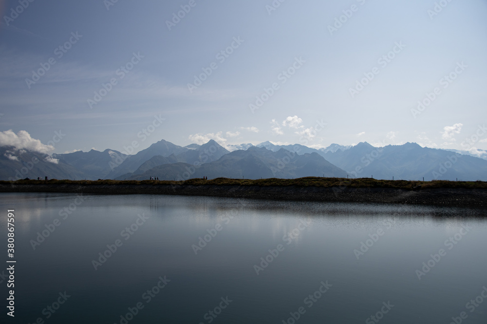 Fototapeta premium artificial lake with the Austrian Alps in the background