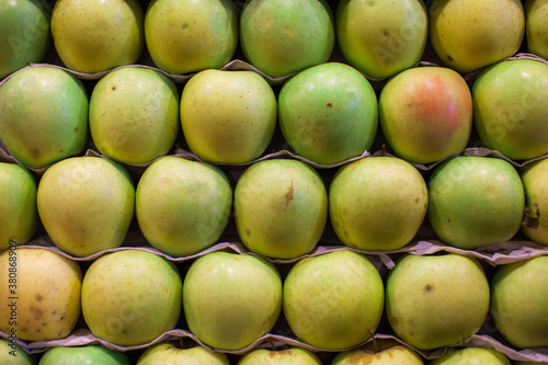 Fresh apples on display at a market photo