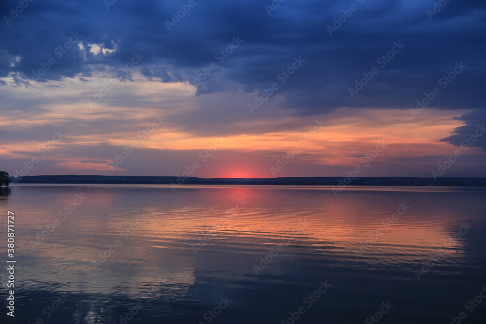 sunset over the lake in summer
