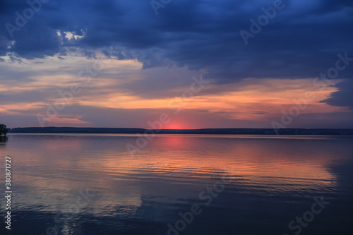 sunset over the lake in summer © Yuri Bizgaimer