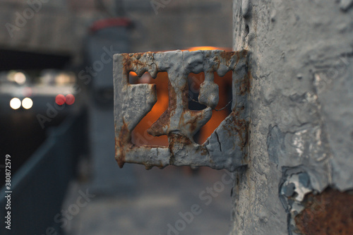 Numeral 29 symbol made from old rusty steel on street