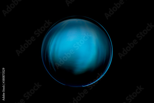 Blurry image of a shiny crystal ball with abstract blurry colorful pattern. Abstract lensball in blur.