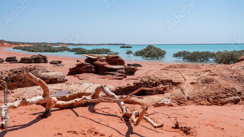 Red sand beach and turquoise water