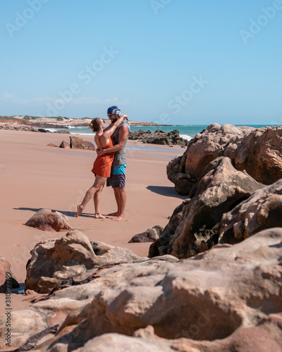 Couple looking romantic at each other on a lonely Beach