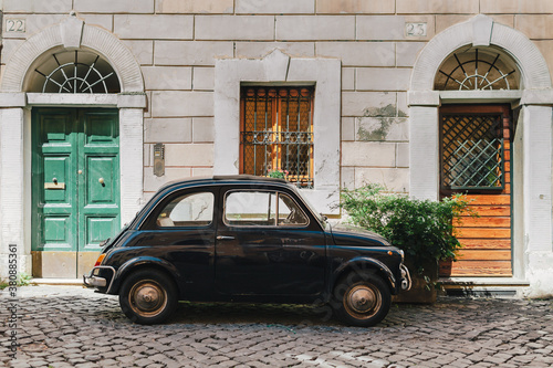 Small Retro Car Parked on the Street In Rome, Italy photo
