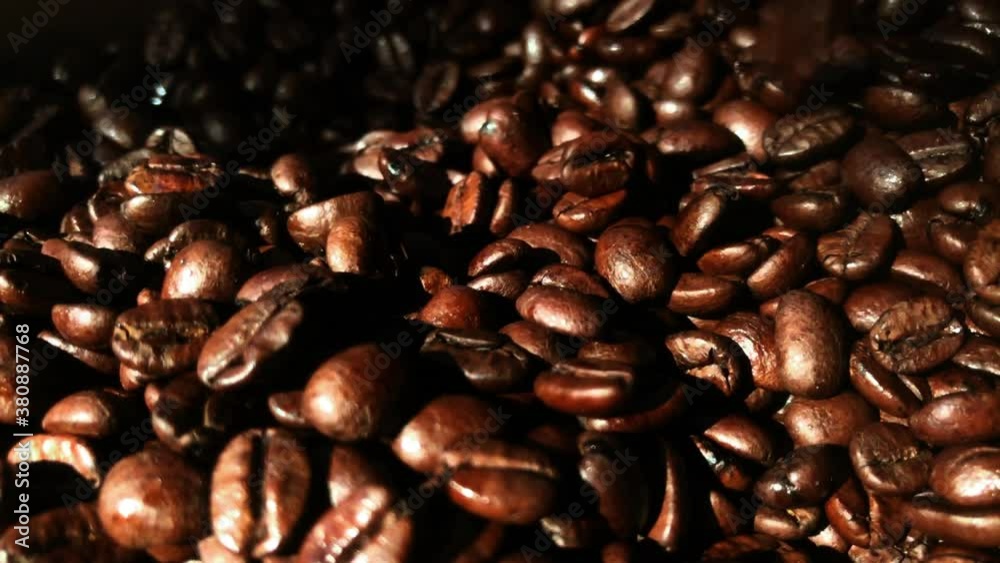 Delicious scent of coffee. Details slow motion shot on coffee beans. Delicious scent of coffee. Details slow motion shot on coffee beans.