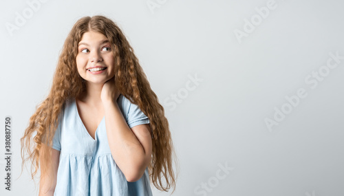 Positive Young blonde woman laughing. Studio shot white background. Human emotions facial expression concept. Copy space