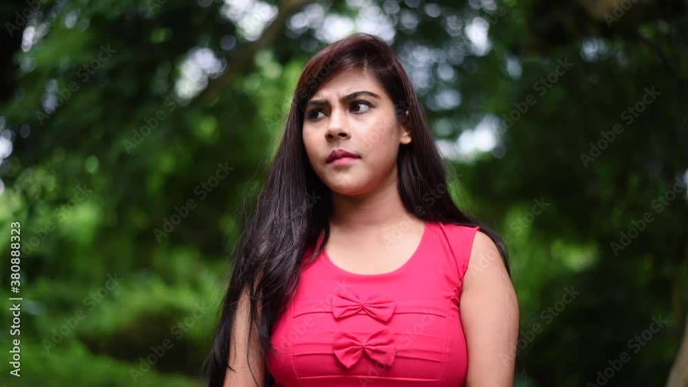 A young unhappy girl rejects or disagrees to something by shaking her head to say no, anti-rape, against of physical abuse, slow motion A young unhappy girl rejects or disagrees to something by shaking her head to say no, anti-rape, against of physical abuse, slow motion