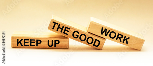 Keep up the good work, text is written on wooden blocks
