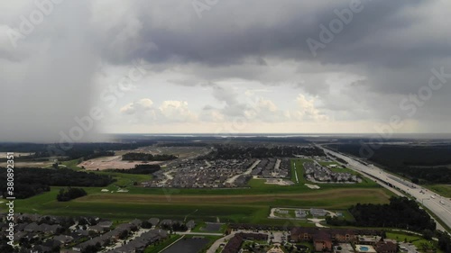 Storm Cells on each side of the Sam Houston Tollway with Lake Houston in the background photo