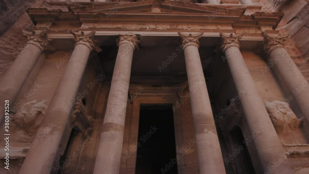 Petra - ancient city, view of Treasury. Jordan. Low angle wide shot tilt up. 4K Petra - ancient city, view of Treasury. Jordan. Low angle wide shot tilt up. 4K