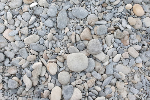 Gray sea pebbles background. Top view.