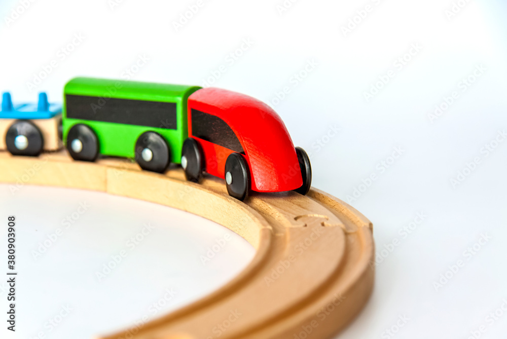 Fototapeta premium Children's railway made of wood on a white background.