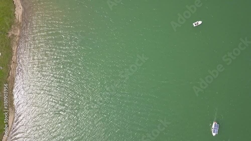 Aerial Top Downshot of boats on lake water photo