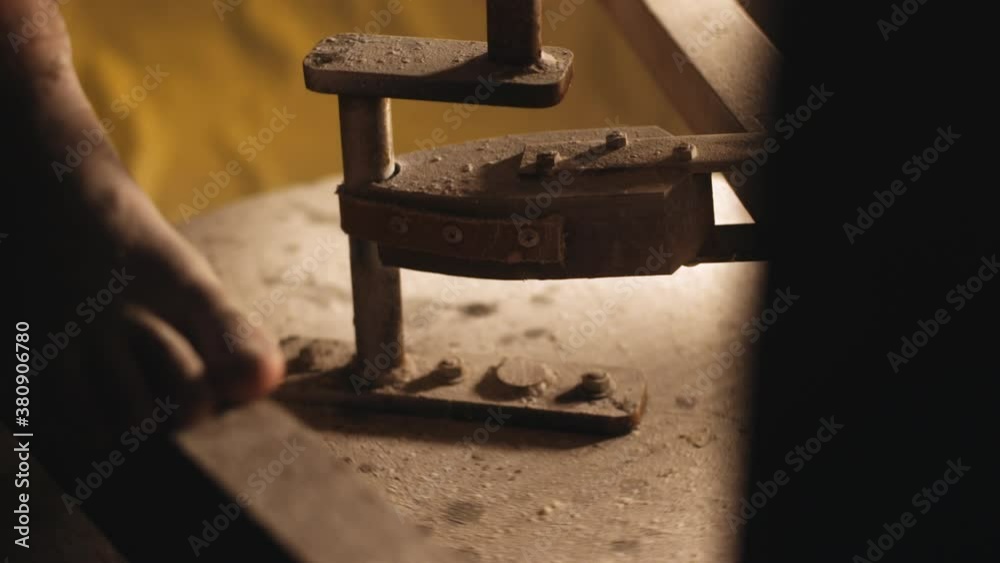 A man shaping clay with his hands on a mill in slow motion. A man shaping clay with his hands on a mill in slow motion.