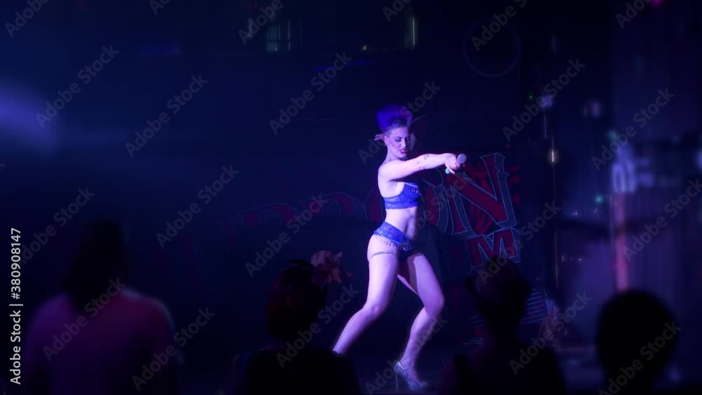 Burlesque showgirl dancing, spinning and having fun on stage Burlesque showgirl dancing, spinning and having fun on stage
