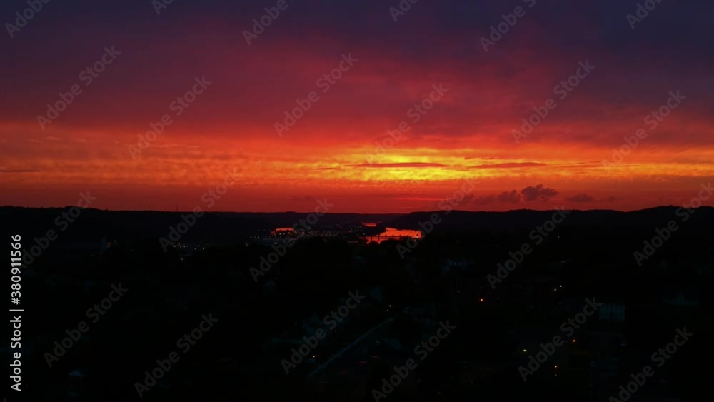 A slow ascending shot of a late sunset and it's reflection on a river. A slow ascending shot of a late sunset and it's reflection on a river.
