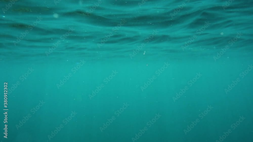 The slow motion of the water surface creates a beautiful bokeh effect. when water flows down from the lens, interesting optical effects and caustics are created. The slow motion of the water surface creates a beautiful bokeh effect. when water flows down from the lens, interesting optical effects and caustics are created.