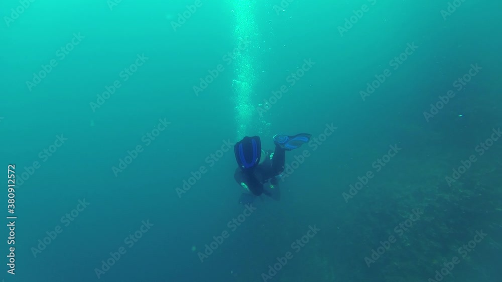 Two explorers dive at Gordon Rocks, Galapagos with very bad visibility, less than 10 meters Two explorers dive at Gordon Rocks, Galapagos with very bad visibility, less than 10 meters