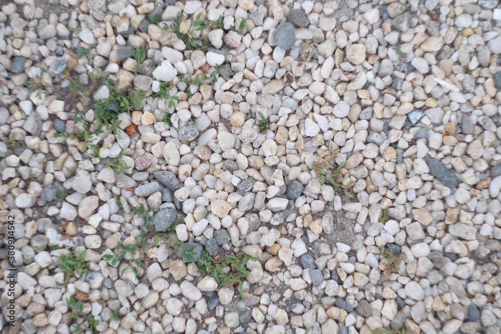 Sea pebbles. Small stones gravel texture background.Pile of pebbles, thailand.