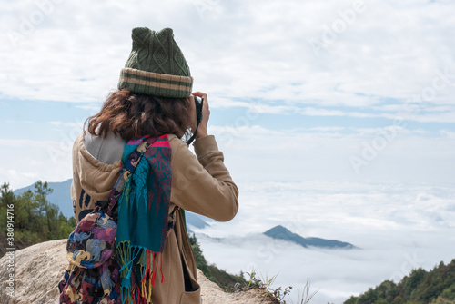Photographers view the sky, clouds and mountains from above.
