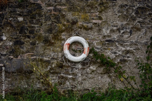 Life Buoy on Stone Wall photo