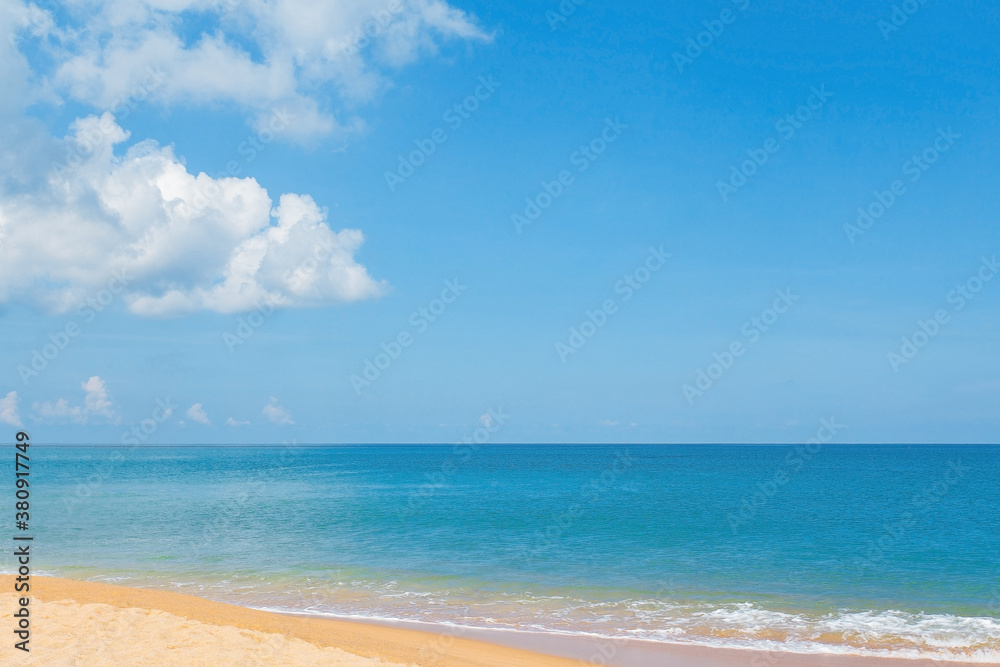 Beautiful golden sandy beach, blue sea and light blue sky with cumulus clouds. Beautiful golden sandy beach, blue sea and light blue sky with cumulus clouds.