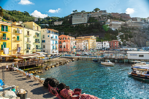 Fototapeta Naklejka Na Ścianę i Meble -  Sorrento, Italy. July 17th 2020. TThe enchanting and picturesque village of Marina Grande with its houses with colorful facades, beaches, restaurants with fish-based cuisine and fishermen's boats.