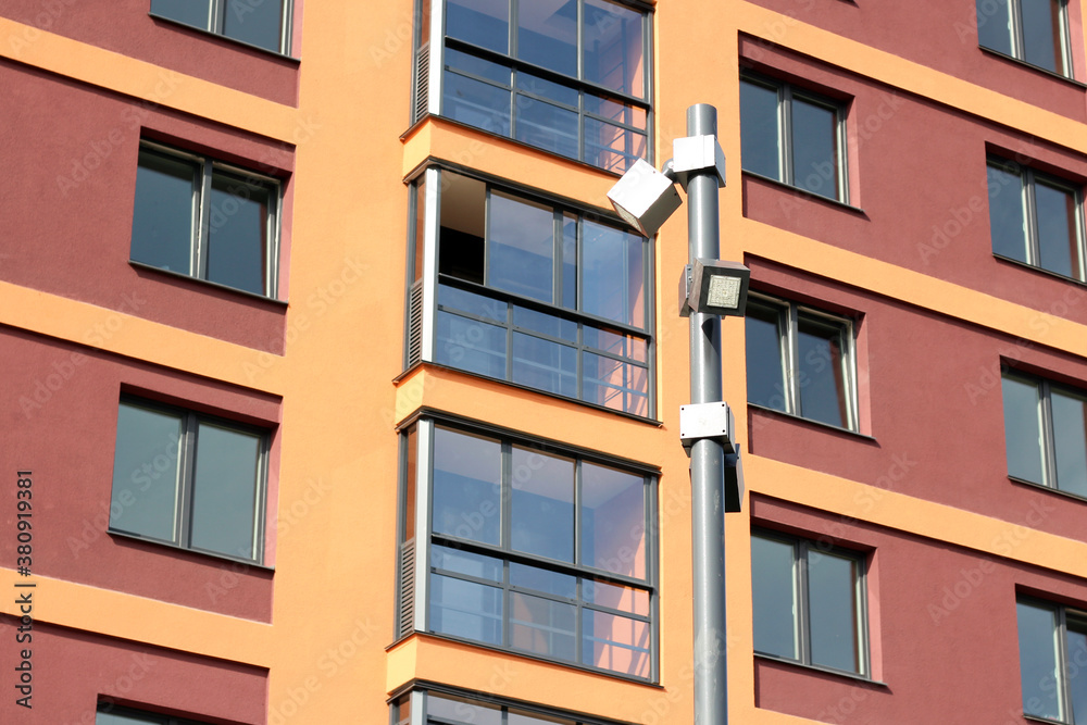 Modern street lamp on the background of the facade of the house Modern street lamp on the background of the facade of the house