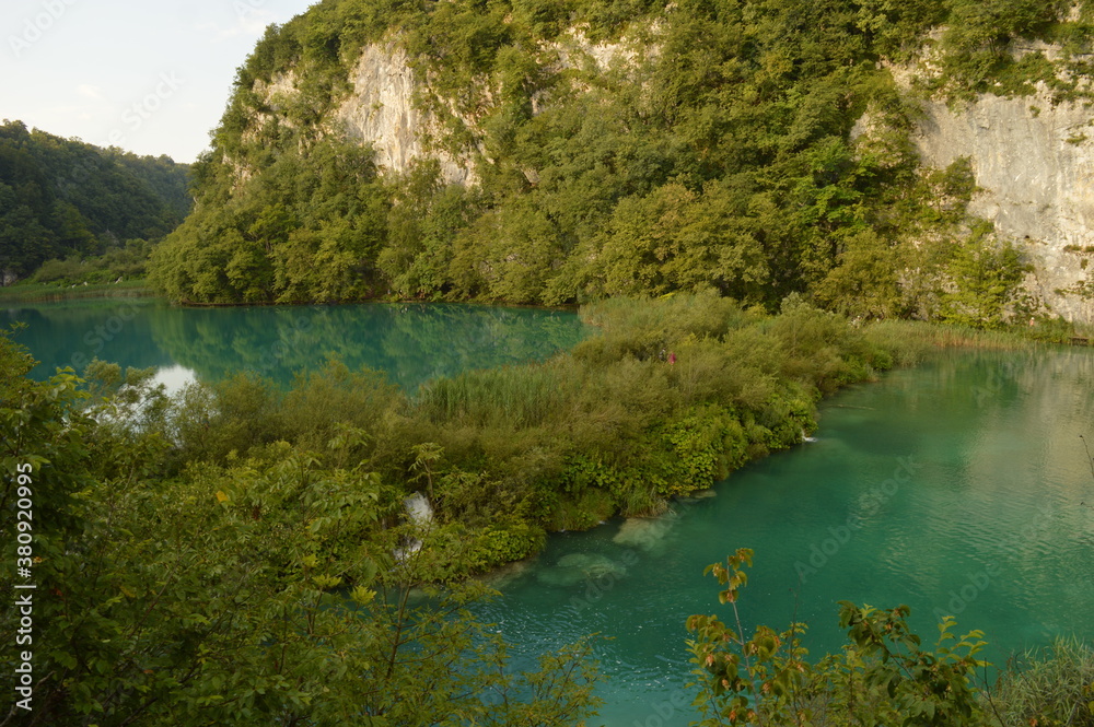 The pathways around the turquoise clear water in the Plitvice Lakes National Park in Croatia