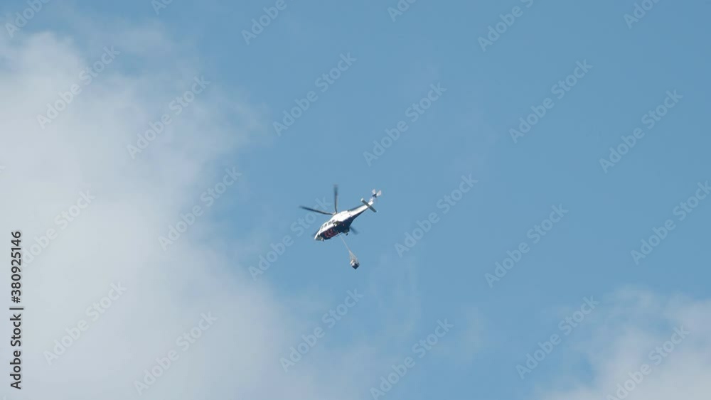 Emergency fire fighting helicopter flying in the sky Emergency fire fighting helicopter flying in the sky