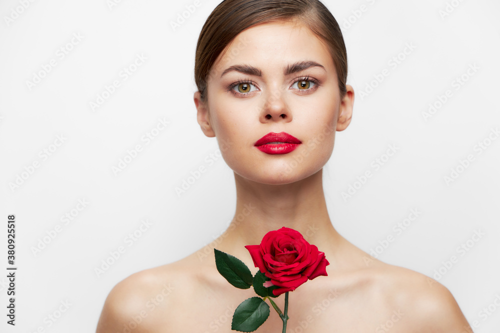 Lady with rose Looks ahead red lips, clear skin luxury light Lady with rose Looks ahead red lips, clear skin luxury light
