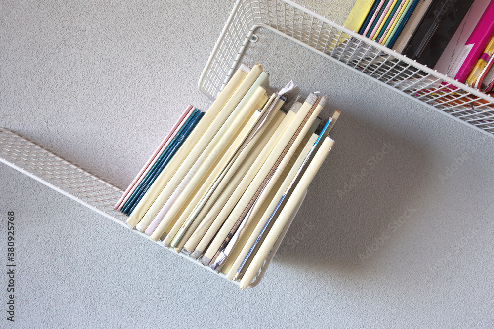 Modern iron rack bookshelf hanging on the wall with school books modern retro design Modern iron rack bookshelf hanging on the wall with school books modern retro design