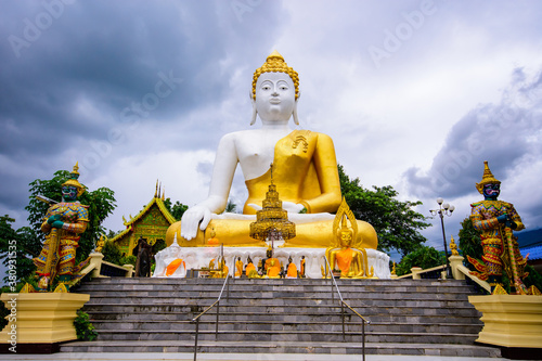 Buddha statue at Wat Phra That Doi Kham in Chiang Mai thailand