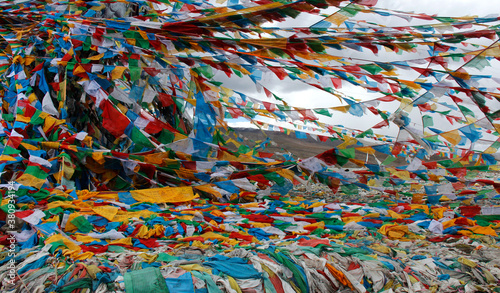 Prayer Flags flying at Gyatsola Pass, Tibet, Central Asia photo