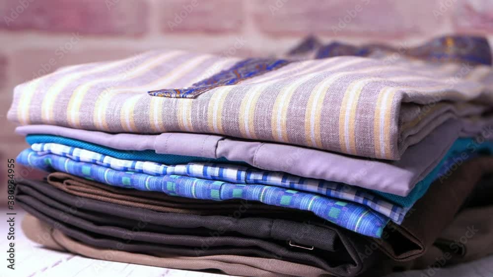 close up of stack of clothes on table . close up of stack of clothes on table .