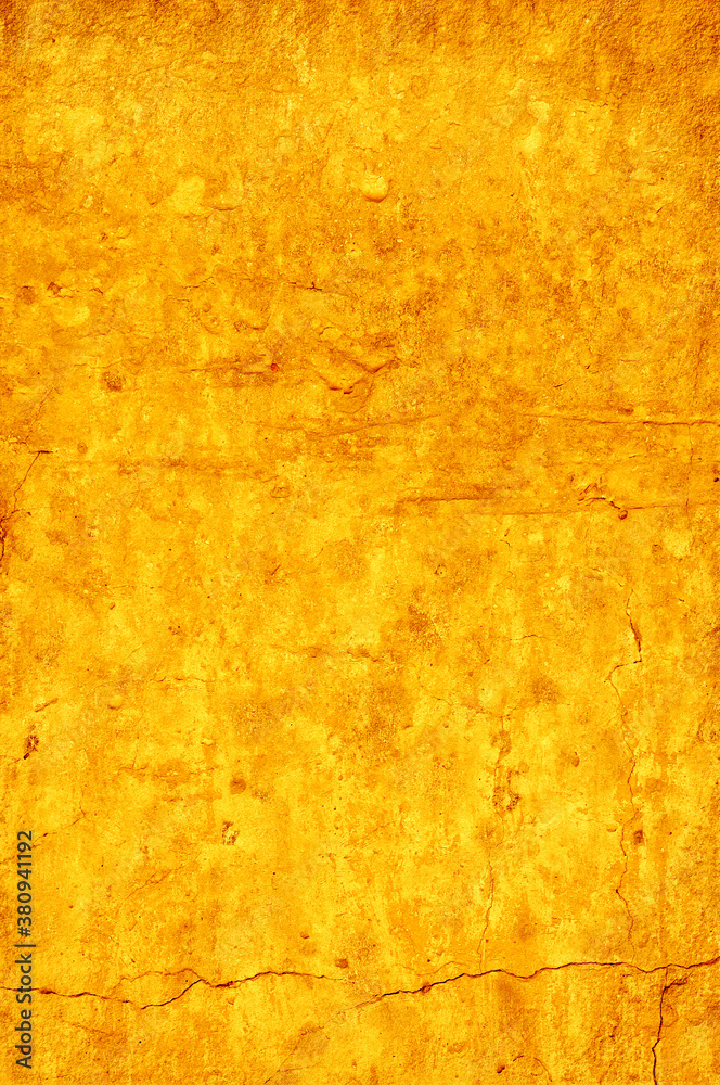 Naklejka premium Bright yellow rough wall as background