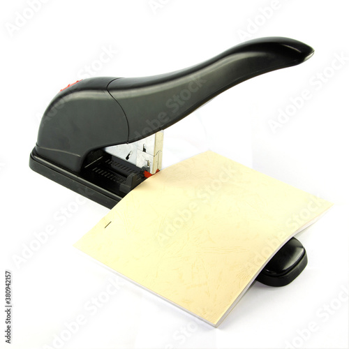 A large stapler for book binding with a lever that forces the paper mag to up and down staples up to 300 sheets of thick paper.