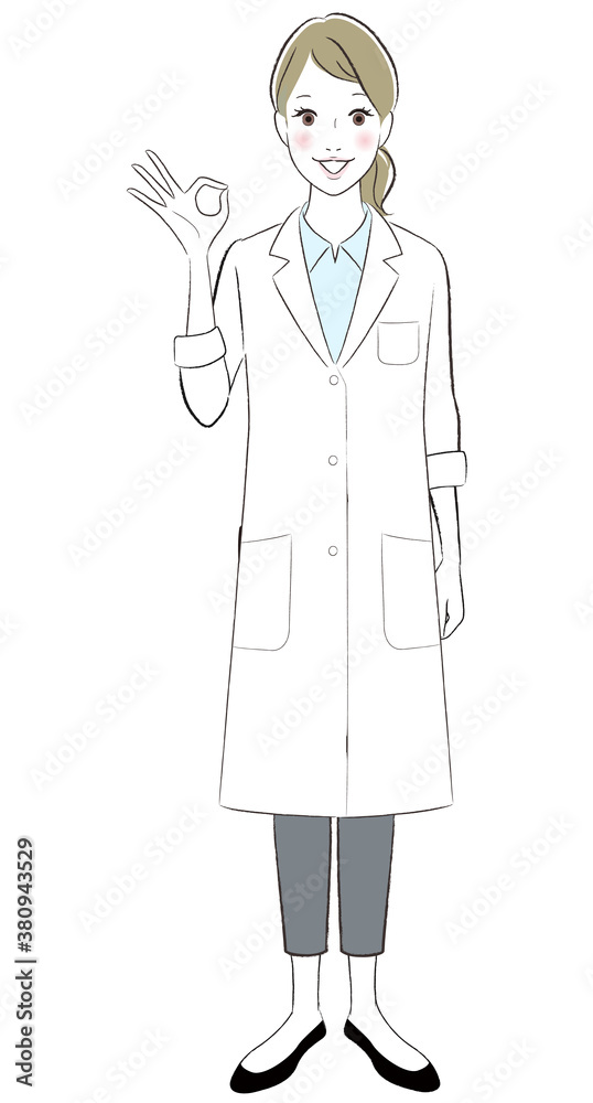 A female doctor wearing lab coat smiling showing ok sign A female doctor wearing lab coat smiling showing ok sign