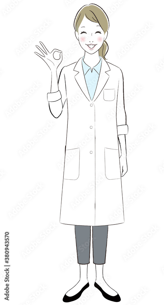 A female doctor wearing lab coat smiling showing ok sign A female doctor wearing lab coat smiling showing ok sign
