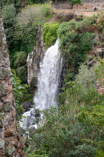 the nepi waterfall surrounded by greenery