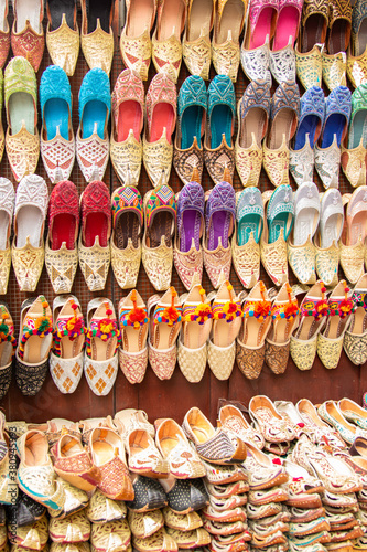 Shoe vendor displaying his colorful wares at one of the many souks in Dubai, United Arab Emirates (UAE)