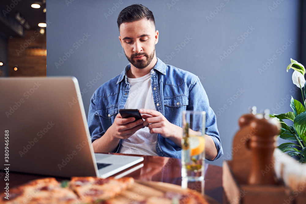 Programmer eating pizza at workplace Programmer eating pizza at workplace