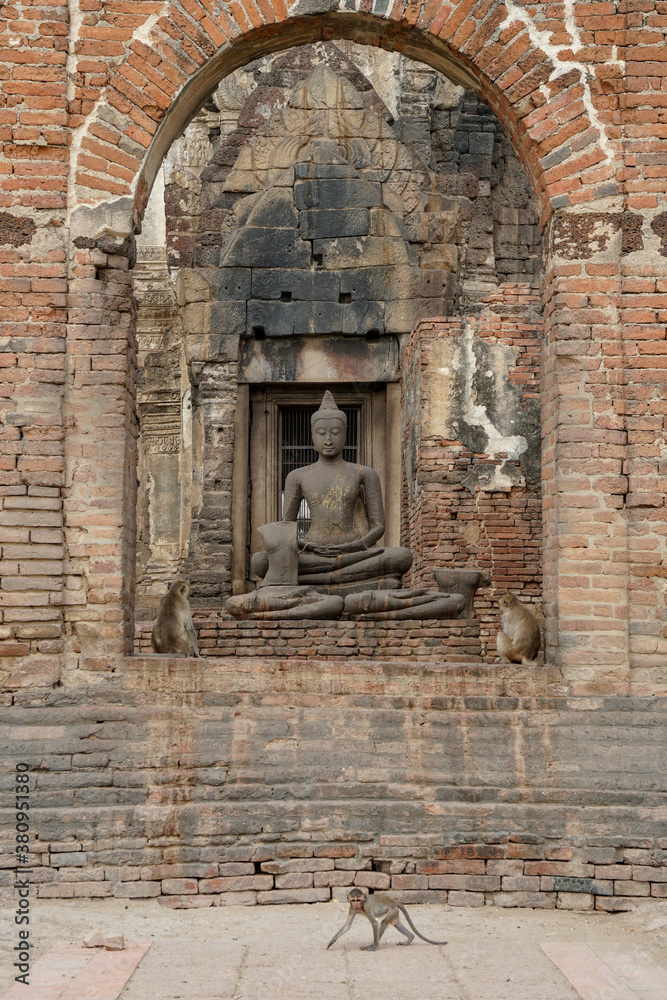 Monkeys in a brick temple archway in Lopburi Monkeys in a brick temple archway in Lopburi
