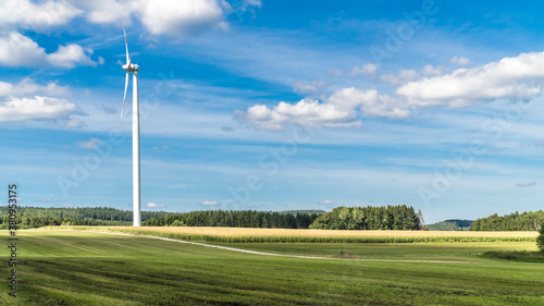 Wind turbine surrounded by agricultural land