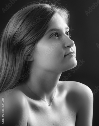 Black and white low key portrait of young girl
