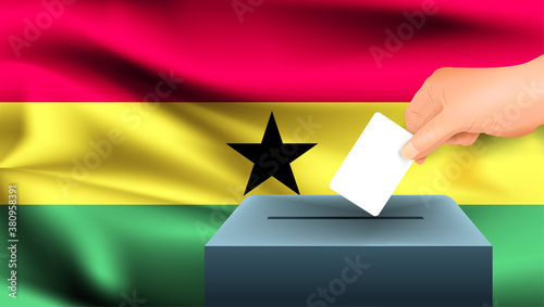 Male hand puts down a white sheet of paper with a mark as a symbol of a ballot paper against the background of the Ghana flag. Ghana the symbol of elections